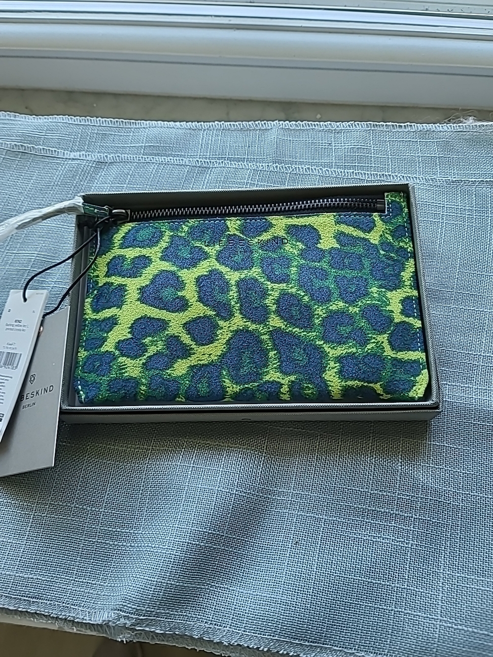 Liebeskind "Flashing Yellow Leo L Printed Crosta" Leather Zippered Pouch.